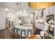 Modern kitchen featuring white cabinetry, stainless steel appliances, and an island with bar seating at 9007 E 60Th Ave, Denver, CO 80238
