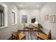 Cozy home office features a desk, rug, and plenty of natural light from the two windows at 9007 E 60Th Ave, Denver, CO 80238