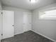 Bedroom featuring carpet, closet, and a window with a view of the outdoors at 740 Moline St, Aurora, CO 80010
