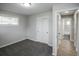 Neutral bedroom featuring carpet and a closet, with a glimpse into the tiled bathroom at 740 Moline St, Aurora, CO 80010