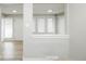 The entryway boasts wood-look floors and a pass-through to another room with natural light at 740 Moline St, Aurora, CO 80010
