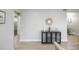 Neutral decor hallway showcasing a view into multiple rooms with hardwood flooring at 740 Moline St, Aurora, CO 80010
