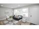 Comfortable living room with a large window, ample seating, and stylish decor at 740 Moline St, Aurora, CO 80010