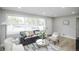 Inviting living room with neutral colors, lots of natural light, and hardwood flooring at 740 Moline St, Aurora, CO 80010