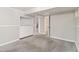Finished basement featuring neutral gray walls, carpet flooring, and convenient built-in storage at 1226 Clayton St, Denver, CO 80206
