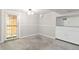 Finished basement with neutral walls and carpet and an exit door at 1226 Clayton St, Denver, CO 80206
