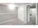 Finished basement with neutral walls and carpet featuring a closet with white doors at 1226 Clayton St, Denver, CO 80206