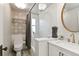 Stylish bathroom featuring decorative tilework, a glass-enclosed shower, and a modern vanity at 1226 Clayton St, Denver, CO 80206
