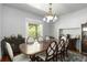 Formal dining room with a large wooden table and chairs, perfect for Gathering gatherings at 1226 Clayton St, Denver, CO 80206