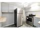 Kitchen offering stainless steel appliances, gray cabinetry, and wood countertops at 1226 Clayton St, Denver, CO 80206