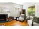 Comfortable living room with fireplace and plenty of natural light from the windows at 1226 Clayton St, Denver, CO 80206