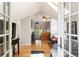 Bright bedroom featuring skylights, a ceiling fan, a dresser, and hardwood floors at 1226 Clayton St, Denver, CO 80206