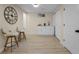 Basement area features a bar area, wood flooring, and ample storage at 7380 Utica St, Westminster, CO 80030