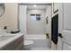 Bathroom with tiled shower and modern fixtures at 7380 Utica St, Westminster, CO 80030
