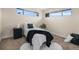Cozy bedroom with natural light, neutral décor, and plush carpet for a comfortable and relaxing retreat at 7380 Utica St, Westminster, CO 80030