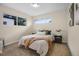 Cozy bedroom featuring a comfortable bed, soft carpet, and natural light from the windows at 7380 Utica St, Westminster, CO 80030
