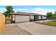 This charming home has a two-car garage and a long driveway at 7380 Utica St, Westminster, CO 80030