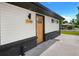 This home features a striking yellow front door and great curb appeal at 7380 Utica St, Westminster, CO 80030