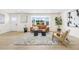 Bright living room with a large bay window, modern decor, and neutral tones for a welcoming ambiance at 7380 Utica St, Westminster, CO 80030
