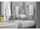 Modern bathroom with dual sinks, chrome fixtures, and neutral tones for a clean and stylish look at 2539 Lawrence St, Denver, CO 80205