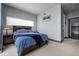 Calm bedroom with a plush queen-sized bed, soft carpet, and minimalist decor for restful nights at 2539 Lawrence St, Denver, CO 80205