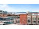 Panoramic city view showcasing a vibrant neighborhood under a clear blue sky with distant mountain peaks at 2539 Lawrence St, Denver, CO 80205
