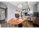 Elegant dining room with a wooden table set for a meal, stylish lighting, and hardwood flooring at 2539 Lawrence St, Denver, CO 80205
