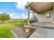 Inviting back patio with string lights, landscaping, and exterior stone accents at 5077 W 108Th Cir, Westminster, CO 80031