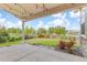 Spacious backyard featuring a covered patio, lush green lawn, and meticulously landscaped garden beds at 5077 W 108Th Cir, Westminster, CO 80031