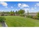 Spacious backyard boasts a lush lawn with well-maintained landscaping and a wooden fence at 5077 W 108Th Cir, Westminster, CO 80031