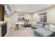 Basement living room includes carpet, a fireplace, and a treadmill at 5077 W 108Th Cir, Westminster, CO 80031