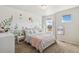 Charming bedroom featuring natural light, plush carpet, and custom wall art at 5077 W 108Th Cir, Westminster, CO 80031