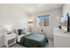 Cozy bedroom with a twin bed, plush carpets, and bright natural light at 5077 W 108Th Cir, Westminster, CO 80031