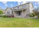 Charming exterior features a covered patio, stone accents, and a well-manicured lawn at 5077 W 108Th Cir, Westminster, CO 80031
