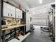 Organized garage featuring storage solutions, workbench, tools, and gym equipment at 5077 W 108Th Cir, Westminster, CO 80031