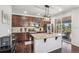 A spacious kitchen featuring an island, stainless steel appliances, and sliding glass doors to the patio at 5077 W 108Th Cir, Westminster, CO 80031
