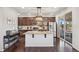 Modern kitchen with stainless steel appliances, a granite island, and ample cabinet space at 5077 W 108Th Cir, Westminster, CO 80031