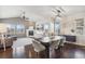 Inviting living and dining area with hardwood floors, a fireplace, and ample natural light at 5077 W 108Th Cir, Westminster, CO 80031
