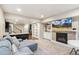 Inviting living room with a cozy fireplace, TV, and comfortable seating area at 5077 W 108Th Cir, Westminster, CO 80031