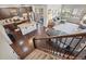 Open concept living space with kitchen, dining area, and stairs. Hardwood floors throughout at 5077 W 108Th Cir, Westminster, CO 80031