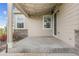 Covered patio with elegant stone accents offering a cozy outdoor space for relaxation at 5077 W 108Th Cir, Westminster, CO 80031