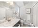 Neutral bathroom featuring a shower-tub combo and dark vanity at 522 Meridian Ln, Superior, CO 80027