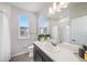 Bright bathroom featuring a white sink, large mirror and ample natural light at 522 Meridian Ln, Superior, CO 80027