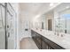 Bright and airy bathroom featuring a glass-enclosed shower and dual vanities at 522 Meridian Ln, Superior, CO 80027