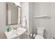 Contemporary half-bathroom featuring a pedestal sink and neutral decor at 522 Meridian Ln, Superior, CO 80027