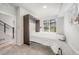 Clean bedroom with white murphy bed, large window, and neutral decor at 522 Meridian Ln, Superior, CO 80027
