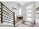 Bright entryway with storage bench, white door with glass panes, and modern staircase at 522 Meridian Ln, Superior, CO 80027