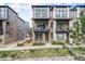 Stylish townhome featuring modern design, balconies, and beautiful landscaping at 522 Meridian Ln, Superior, CO 80027