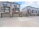 Modern townhome exteriors with attached garages and stylish architectural details at 522 Meridian Ln, Superior, CO 80027