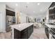 Open-concept kitchen featuring a large island with seating and stainless steel appliances at 522 Meridian Ln, Superior, CO 80027